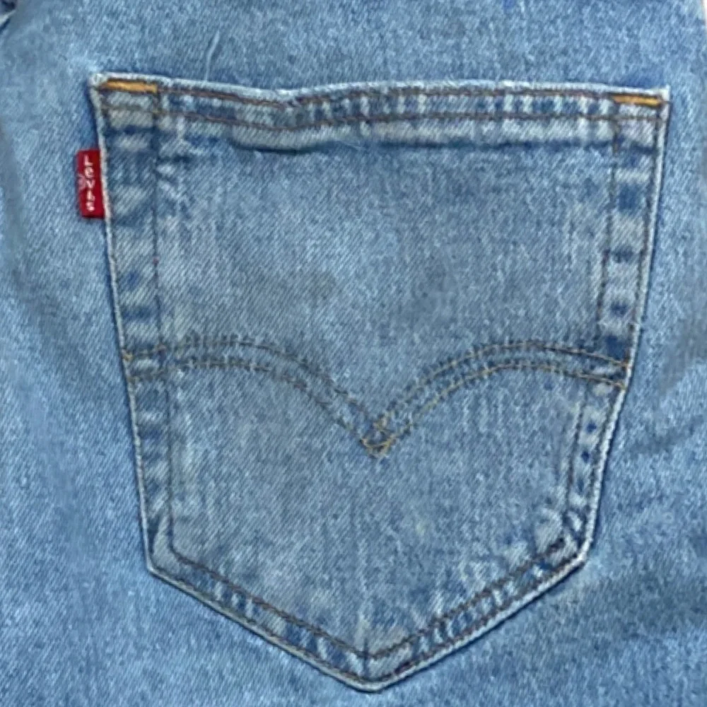 Levi's 512 Slim Fit Distressed Tapered Light Wash Jeans - Picture 9 of 16